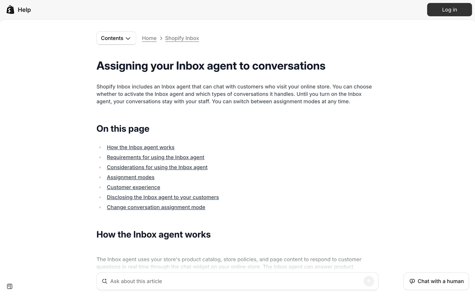Screenshot of the Shopify Help Center article "Assigning your Inbox agent to conversations", explaining that the Inbox agent chats with visitors to your online store and that conversations stay with your staff until you turn it on, at help.shopify.com/en/manual/inbox/assigning-your-ai-staff-member, captured 15 October 2026.